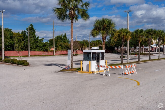 A security guard enhances protection upon entering Colonial High School.