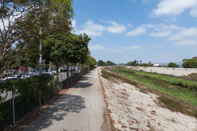 Locals walk through nature along Compton Creek in Rancho Dominguez, CA.