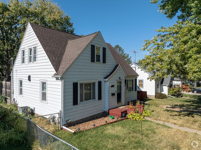 Experience the unity of Neighbors Helping Neighbors through a row of quaint homes.