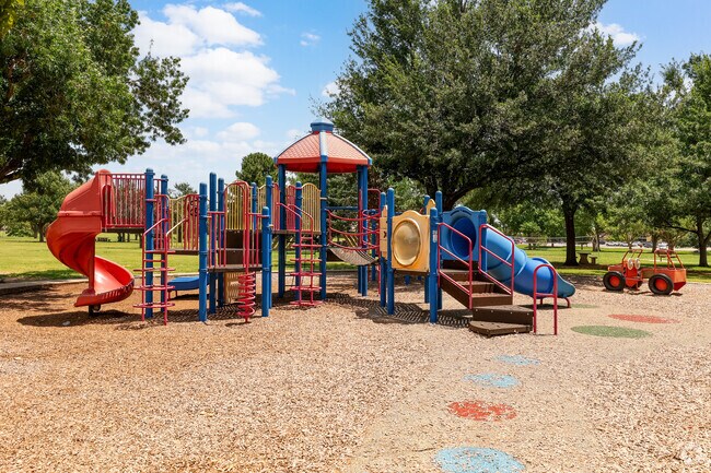 Families can enjoy the tennis courts and playground at Earlywine Park.