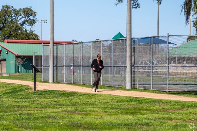 A resident of Lake Jackson takes a morning run along one of the neighborhood's many trails.