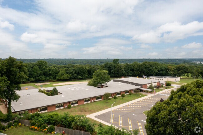 Trees in Huntington, NY surround Woodhull Intermediate School.