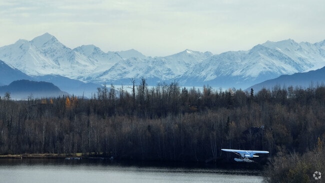 A small plane flys off into the Alaskan wilderness from North Lakes.