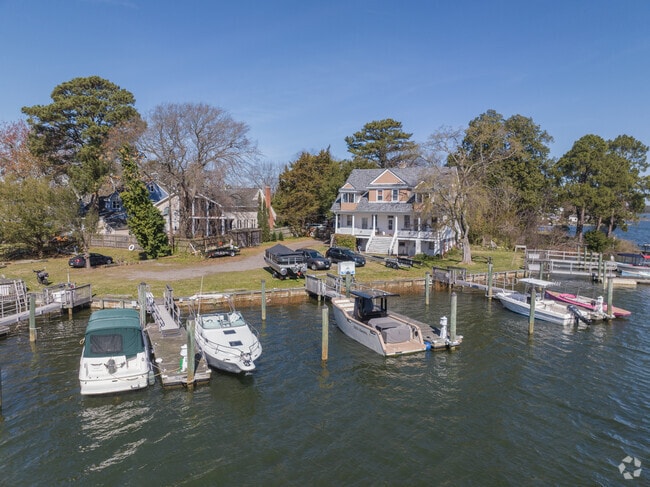 Waterfront Homes have boats ready to dock near the backyard in Colonial Place & River View.