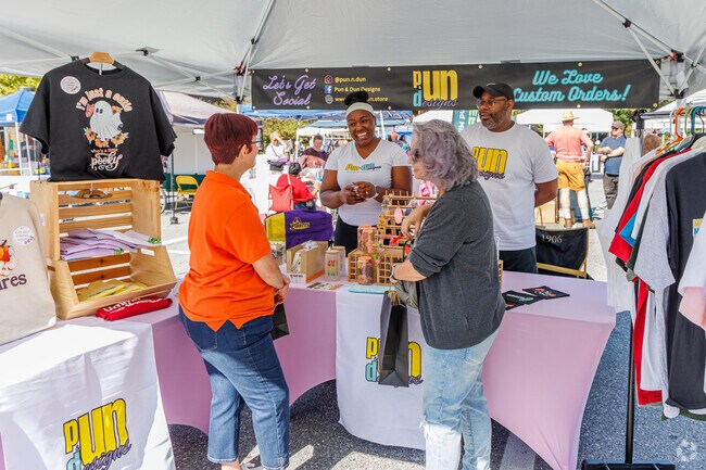 A local business offers custom designs for clothing at the Oakland Mills Fall Festival.