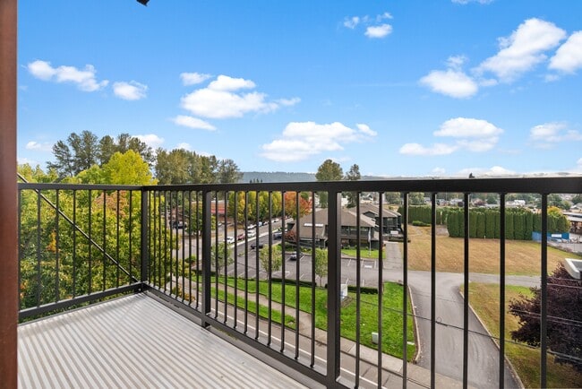 Step out onto your private balcony and take in peaceful views of the neighborhood and surrounding greenery.