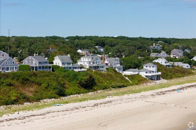 Multistory homes sit near the shoreline in Sagamore Beach.