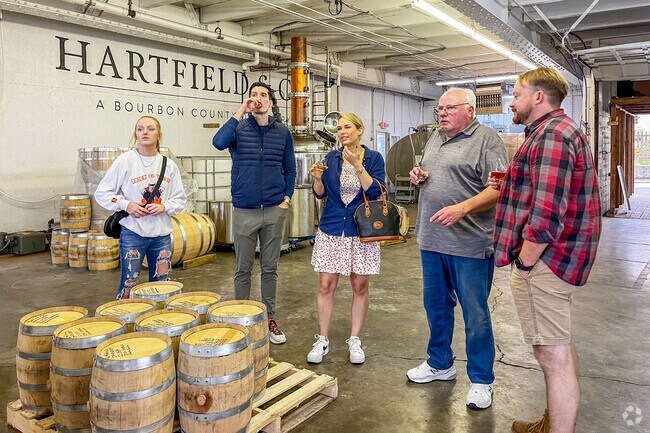 Visitors to Jimtown stop by Hartfield & Company distillery for some bourbon tasting.