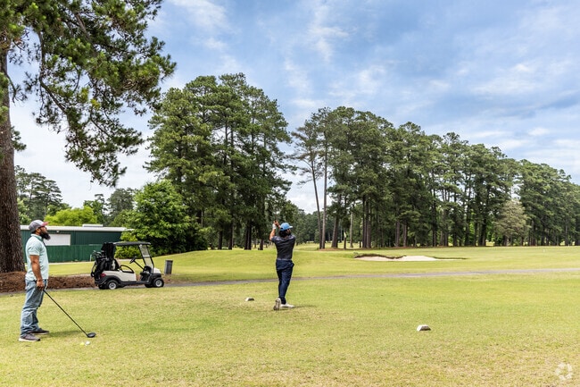 Golfers tee off at Cypress Cove Country Club, a premier golfing destination in Franklin, Virginia.
