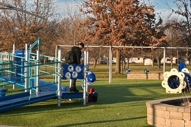 A father and his young child brave the cold weather to enjoy Taylor's Dream near Lake Forest.