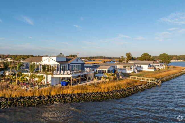 Enjoy every sunrise and sunset from the comfort of a waterfront home in Long Neck.