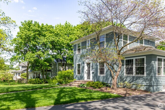 Homes are nestled behind established trees in the Prairie Grove neighborhood.