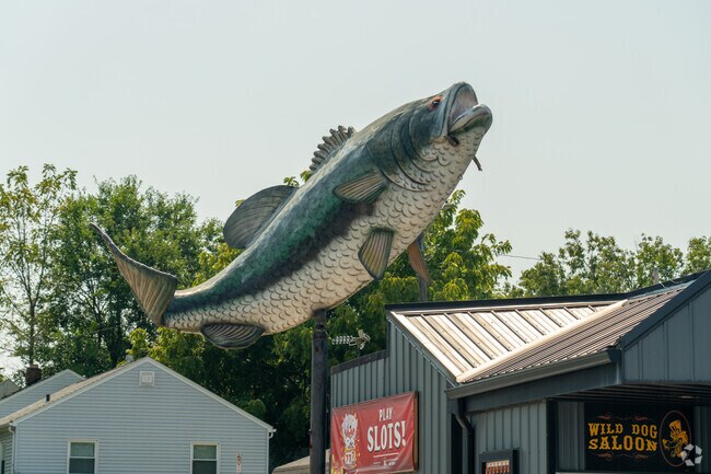 A colossal bass welcomes patrons to Wild Dog Saloon for a beer or a round of pool.