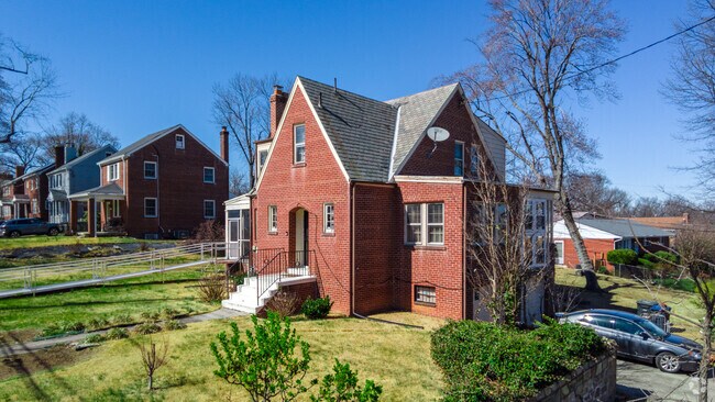 A brick cottage with a large yard stands out in Dupont Park.