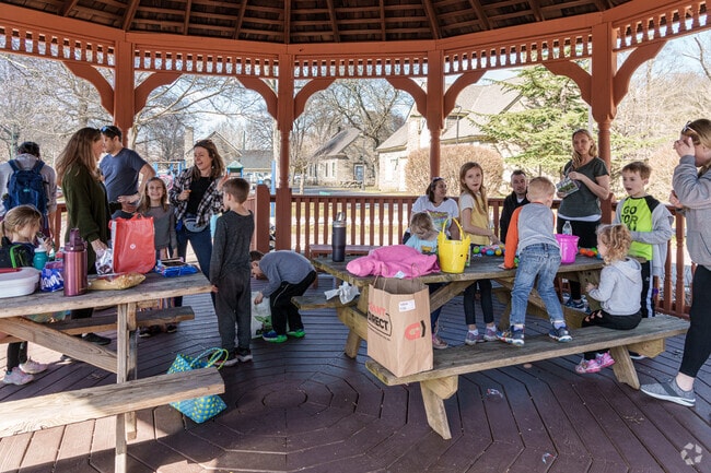 Several families gather for lunch in the pavilion at Merry Place Park in Broomall.