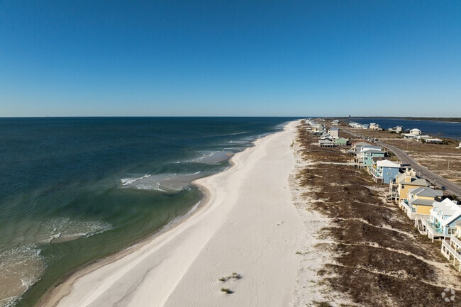 Cozy bungalows nestled among the dunes of Gulf Shores.