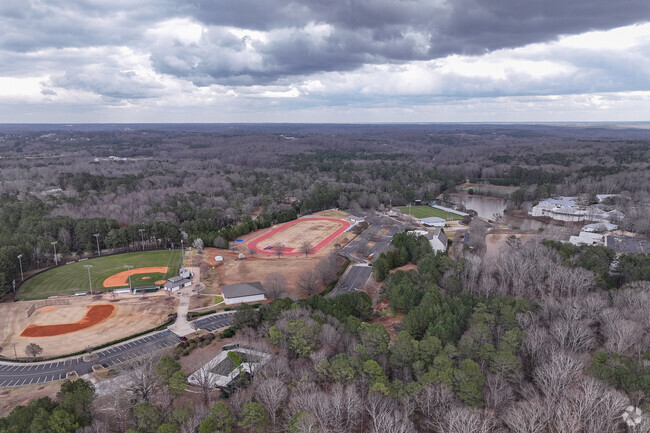 Athens Academy is surrounded by mature trees and scenic lakes.