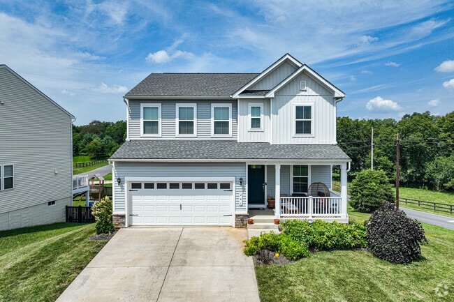 New Traditional homes in Boyce offer spacious garages, manicured lawns, and scenic views of the Shenandoah Valley.