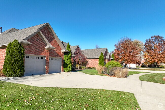 Rows of maintenance free duplexes sit along the entrance to Sandy Pines Golf Course.