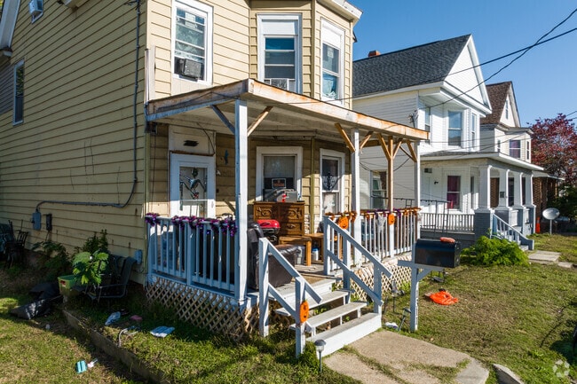 A row of homes in Chestnut features homes with elevated front porches and awnings.