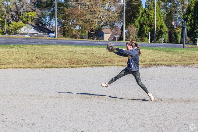 A fast-pitch pitcher hones her skills at a nearby ball field in Stokesdale.