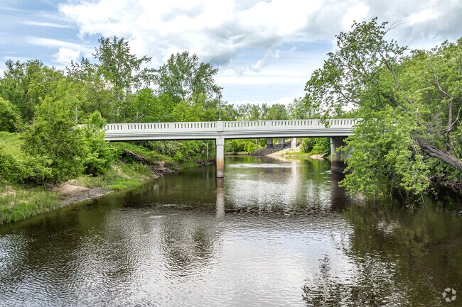 The Second Avenue bridge crosses the Rum River and can be seen from the fishing pier at Cambridge City Park.