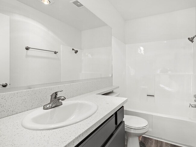 Modern styled bathroom with shower and tub.