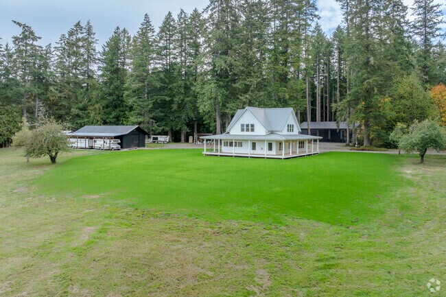 Traditional farm houses can be found on acreage in Olympic View WA.