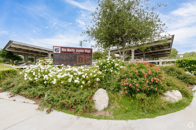 Colorful flowers decorate the entrance sign to Rio Norte Junior High School in Valencia, CA.