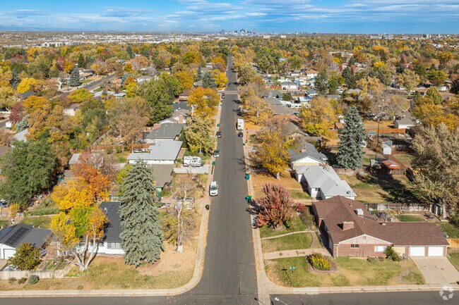 The downtown Denver skyline can be seen from the homes of Belleview-Cornerstone Park.