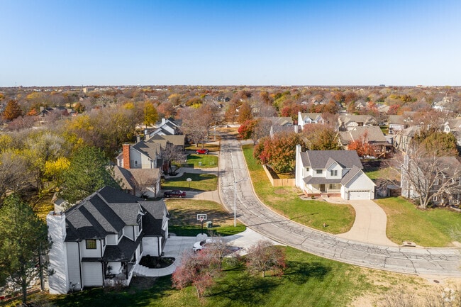 Tall and mature trees surround these Northeast Wichita homes.