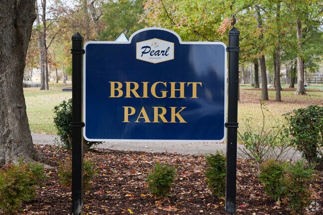 Bright Park boasts a spacious walking trail and a lush canopy of trees.
