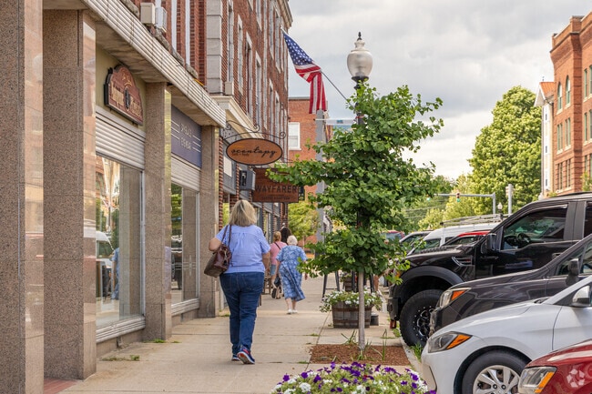 Residents stroll the downtown shops in Laconia, NH