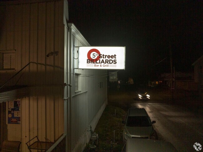 The 5th Street Billiards Bar & Grill in nearby Dupo, IL has many pool tables and great food.