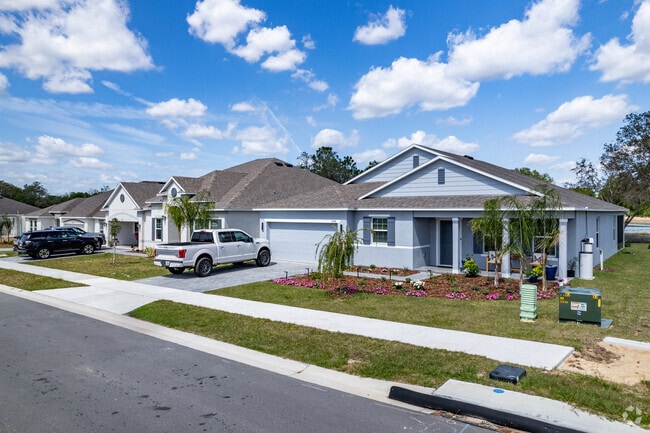A row of three-bedroom Craftsman bungalows in Mascotte.
