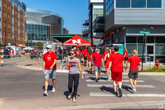 After home football games, fans celebrate in the streets of Haymarket near Greater South.