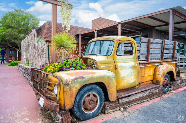 An old truck has been repurposed into an eclectic garden in the City of Benbrook.