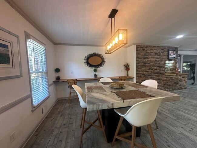 Modern luxury meets functionality — marble kitchen table and extended bar area designed for style.