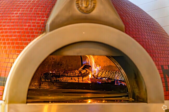 Sandyston locals enjoy a fresh pizza at the Mountain House, cooked in a new Italian wood oven.