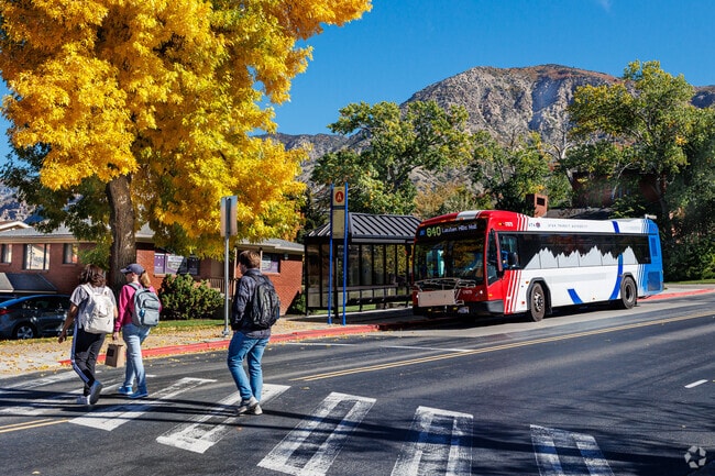Students cross the street near Weber State University.