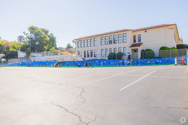 St. Roberts has a large pavement play area fitted with basketball courts.