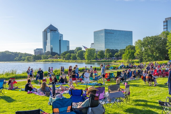 People relaxing at the Bloomington Summer Fete.