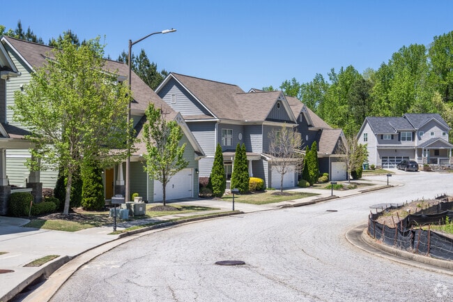Traditional style homes line the streets of Browns Mill Park with shallow front yards.