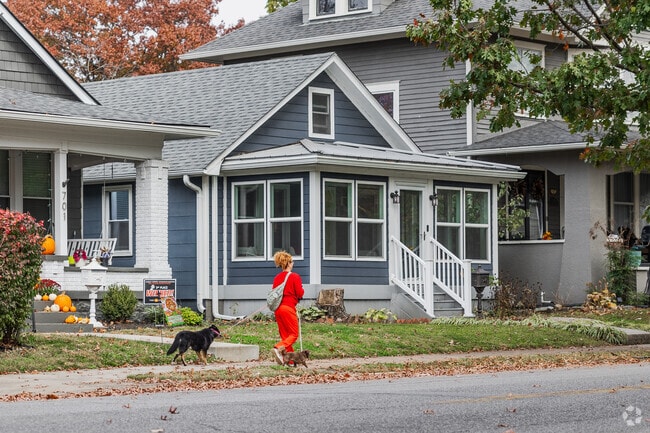 Jeffersonville locals take advantage of the wide sidewalks while walking their dogs.