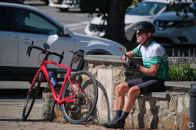 A cyclist takes a break at Purcellville Station by the W&OD trail.