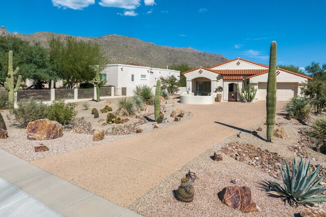 The red tile and the white stucco make this Spanish-style home stand out in the desert heat.