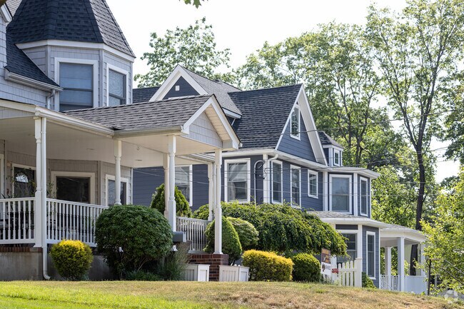 Colonial style houses on a tree lined street in Montvale, NJ.