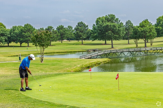 A golfer practices precise putting strokes on lush greens in Browns Summit.