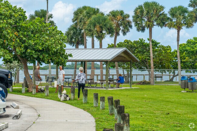 Enjoy walking your dog by the river in Sandsprit Park.