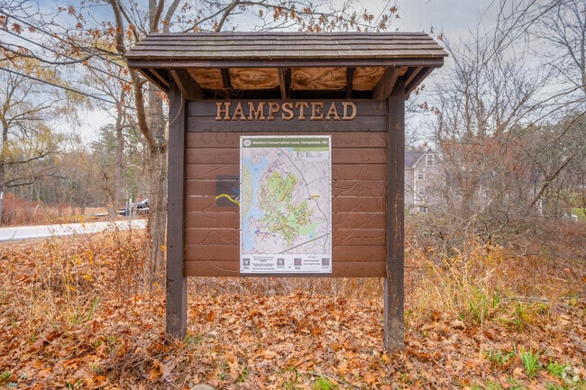 This trailhead sign marks the entrance to the West Road Conservation Area, which offers six miles of hiking and biking trails.